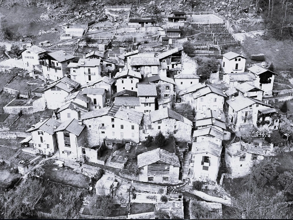 Locality Musci, group of stone houses in black and white